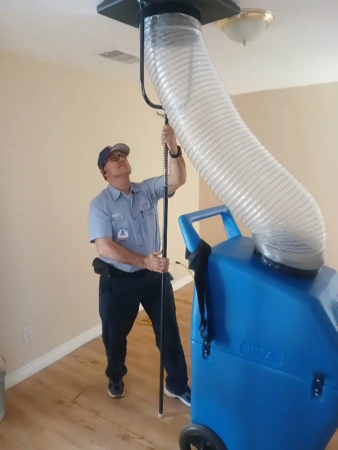 Furnace Tune-Up technician using HEPA equipment in Glenview